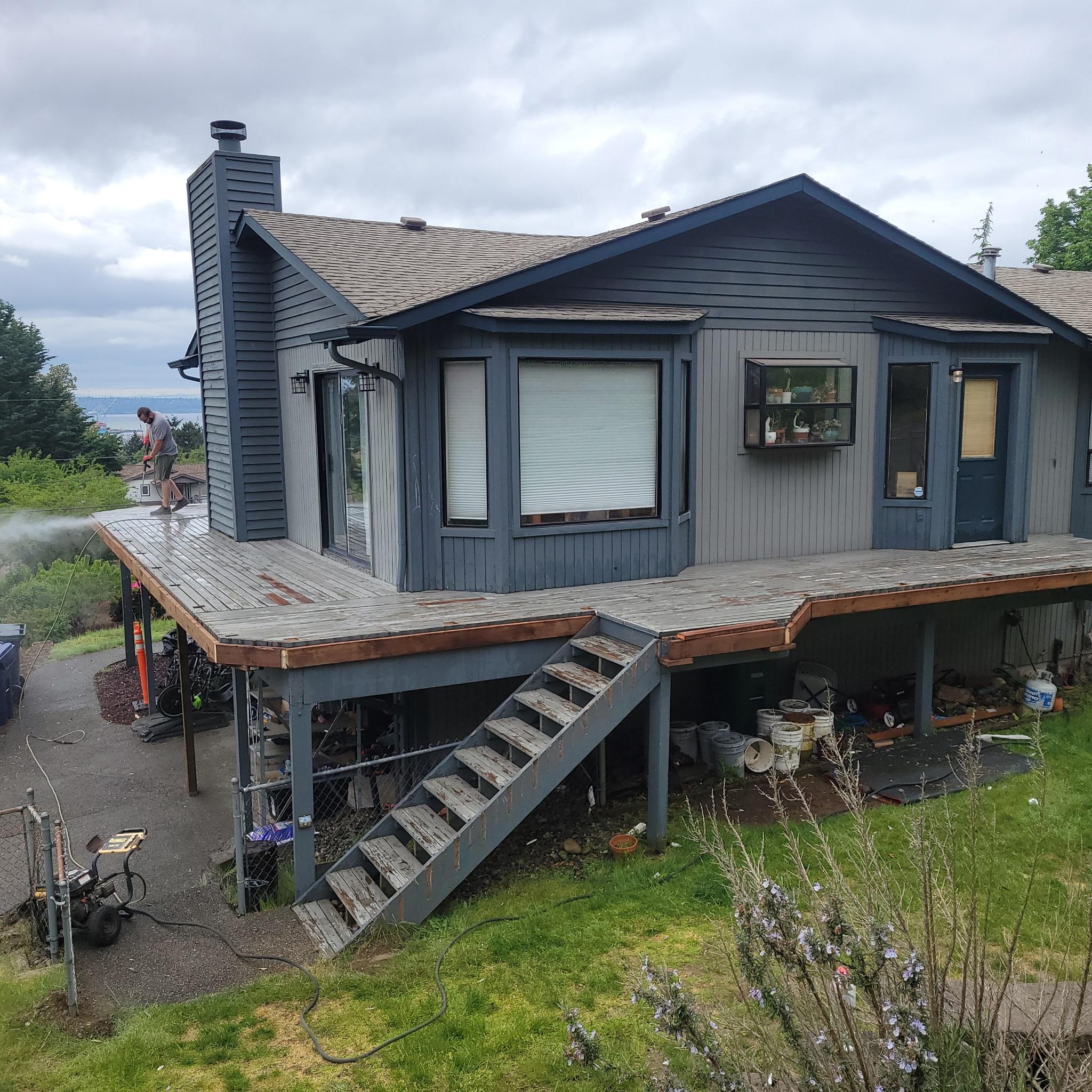 Deck pressure washing in progress